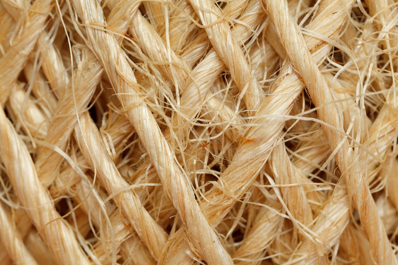 A close-up view of natural, fibrous rope, resembling the materials used in the Stone Age.