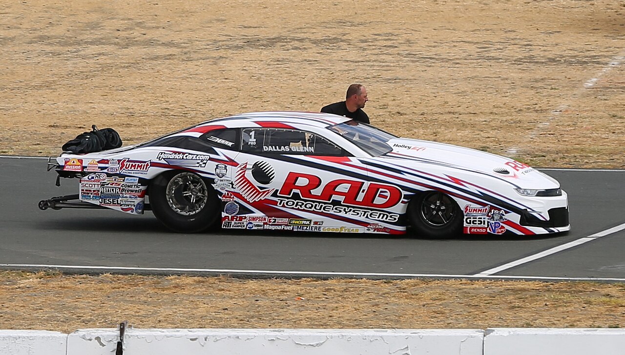 A Pro Stock race car driven by Dallas Glenn on a drag strip.