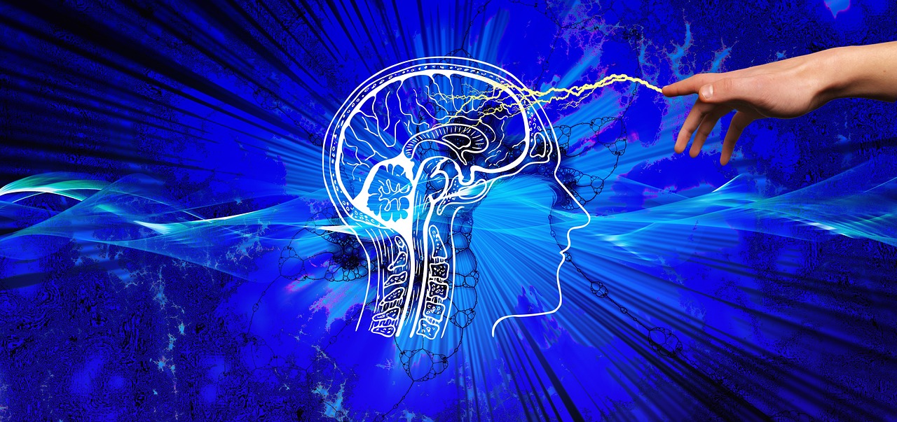 A stylized illustration of a human head profile with a brain outline, connected by a spark of light to a human hand, set against a blue abstract background.