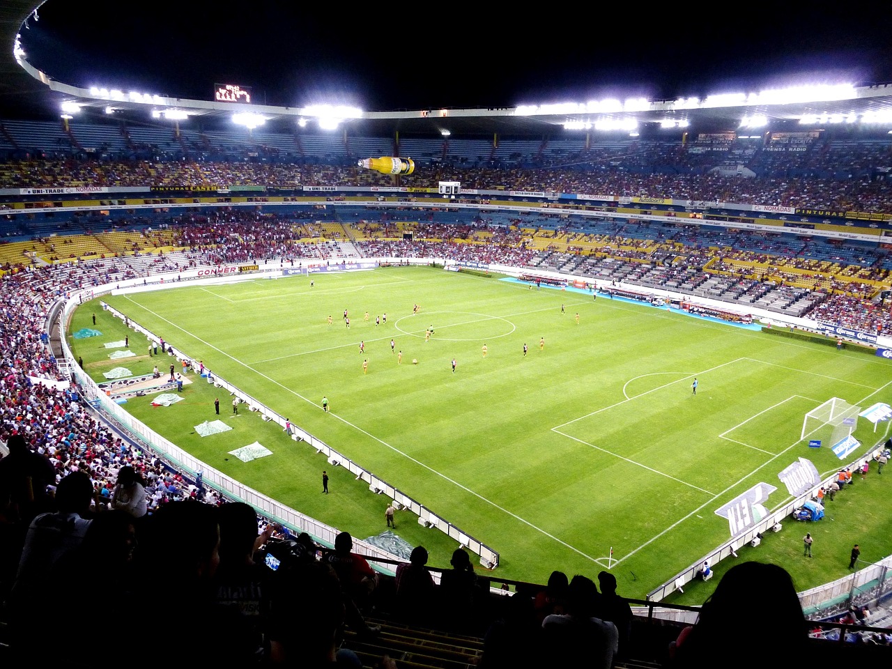 A football stadium under floodlights