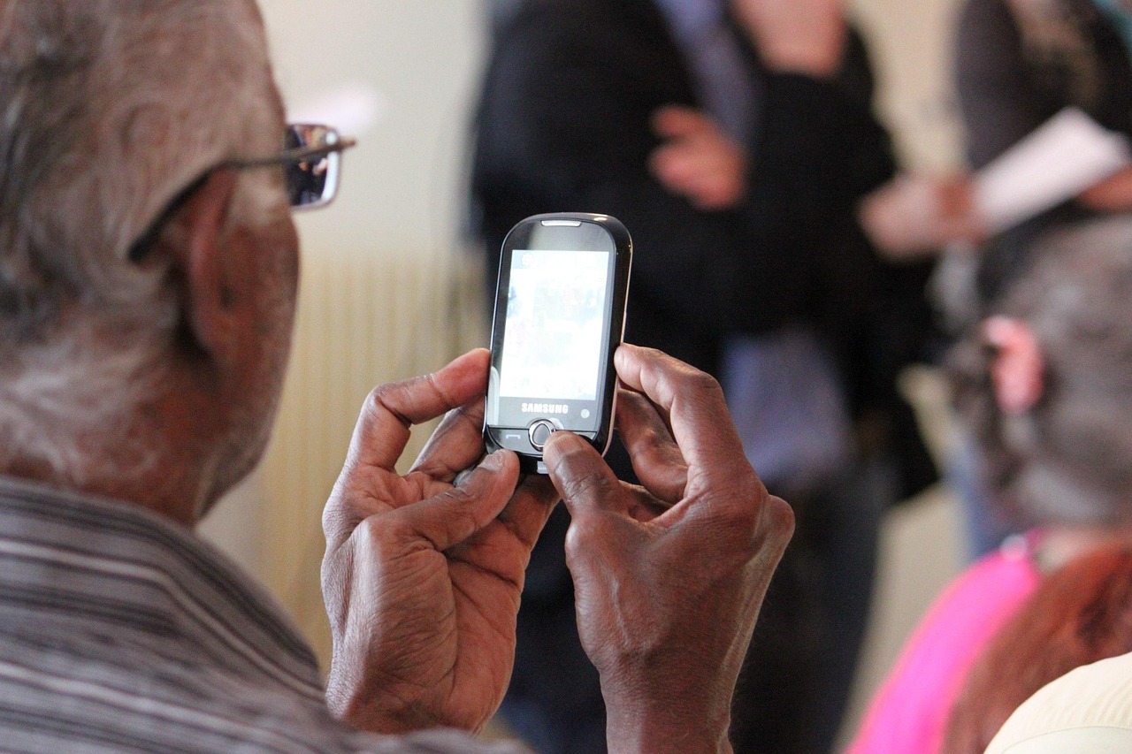 Stock photo: senior using smartphone